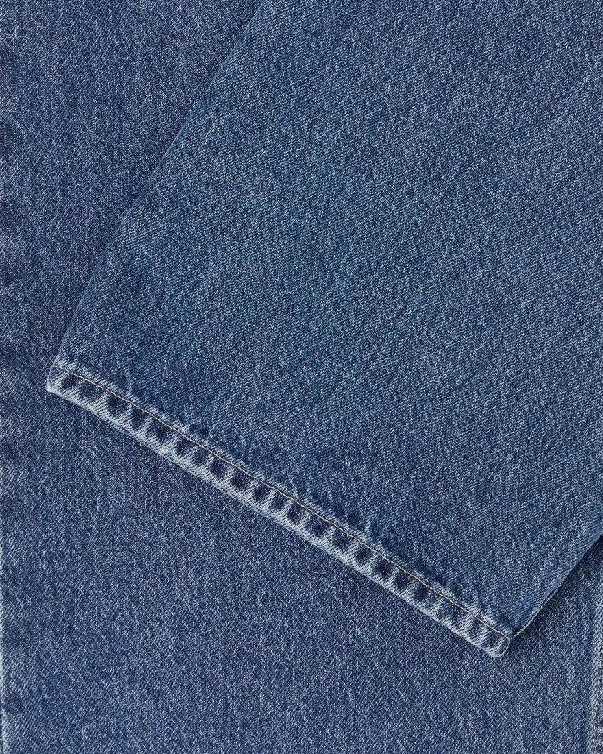 MATRIX PANT - Blue Mid Marble Wash 30'' showing detail of the denim fabric and stitching for a loose straight-fit pant.